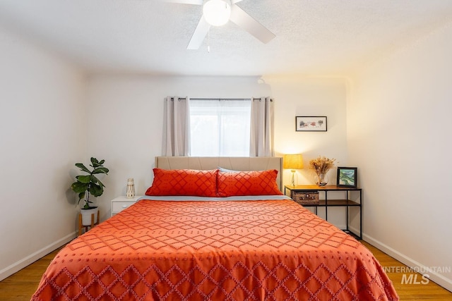 3102 N Sycamore Dr, Boise, ID 83703 - bedroom featuring wood finished floors, baseboards, and ceiling fan