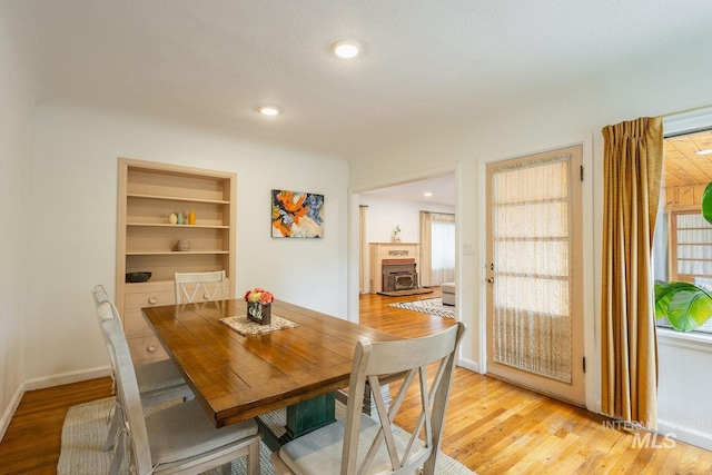 3102 N Sycamore Dr, Boise, ID 83703 - dining room with light wood-type flooring, built in features, baseboards, and recessed lighting