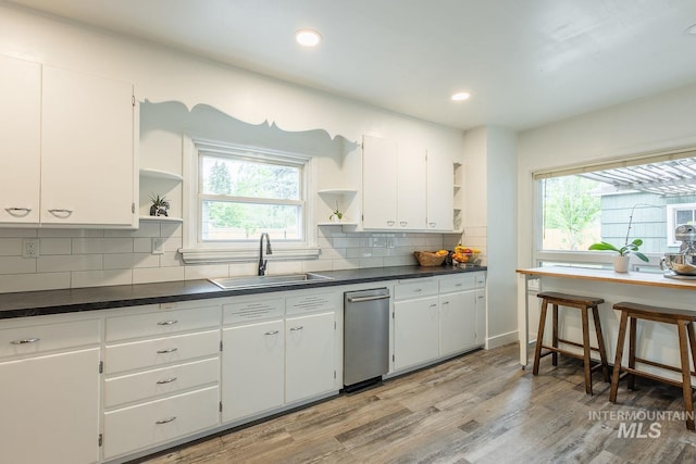 3102 N Sycamore Dr, Boise, ID 83703 - kitchen featuring open shelves, a sink, healthy amount of natural light, dark countertops, and recessed lighting
