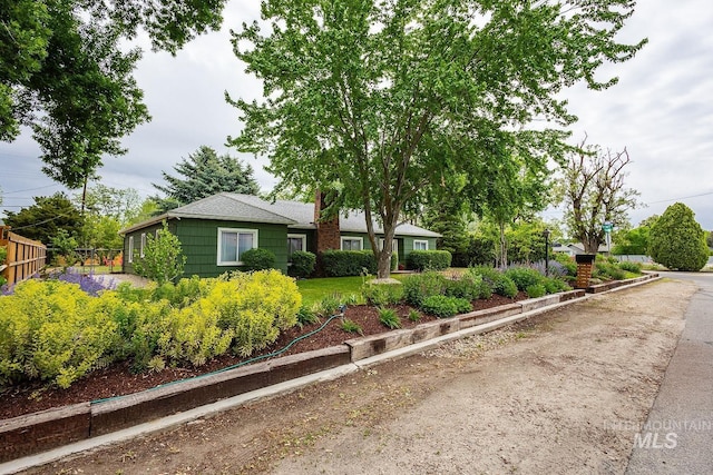 3102 N Sycamore Dr, Boise, ID 83703 - ranch-style house with fence and a chimney