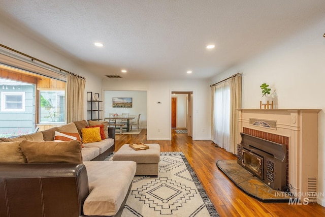 3102 N Sycamore Dr, Boise, ID 83703 - living room featuring wood finished floors, recessed lighting, and baseboards