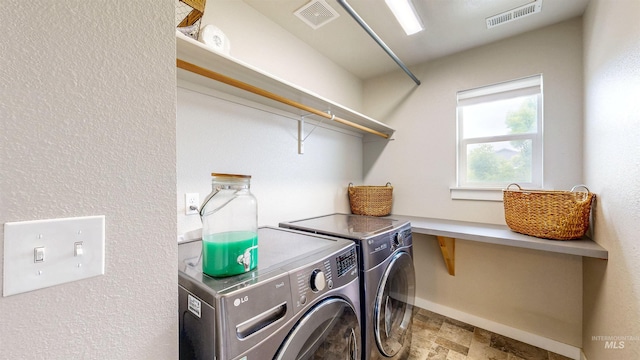 161 S Baraya Way, Meridian, ID 83642 - laundry area with washing machine and dryer, baseboards, and stone finish flooring
