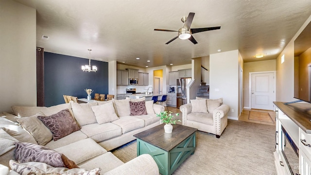161 S Baraya Way, Meridian, ID 83642 - living area featuring a chandelier, a ceiling fan, stairway, light colored carpet, and baseboards