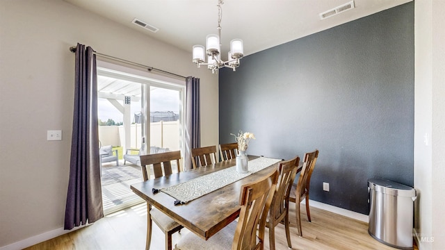 161 S Baraya Way, Meridian, ID 83642 - dining room featuring a chandelier, baseboards, and light wood-style floors