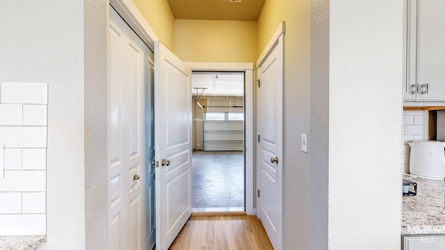 161 S Baraya Way, Meridian, ID 83642 - hallway with light wood-style flooring, a textured wall, and baseboards