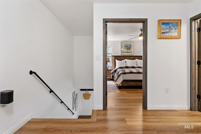 16 Grouse Rd, Idaho City, ID 83631 - staircase with baseboards, a ceiling fan, and wood finished floors