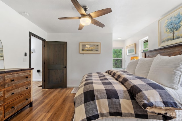 16 Grouse Rd, Idaho City, ID 83631 - bedroom with baseboards, a ceiling fan, and wood finished floors