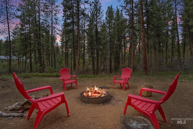 16 Grouse Rd, Idaho City, ID 83631 - patio terrace at dusk featuring an outdoor fire pit