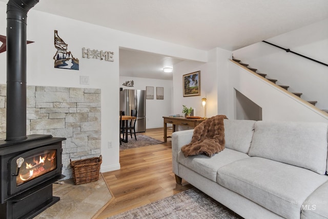16 Grouse Rd, Idaho City, ID 83631 - living area with a wood stove and wood finished floors