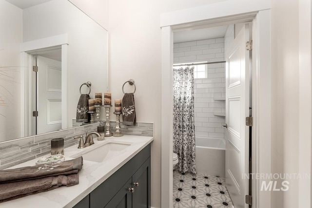 bathroom featuring tile patterned flooring, toilet, vanity, and shower / bathtub combination with curtain