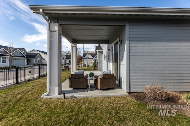 view of patio featuring fence, an outdoor hangout area, and a residential view
