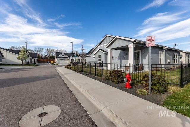 exterior space featuring fence and a residential view