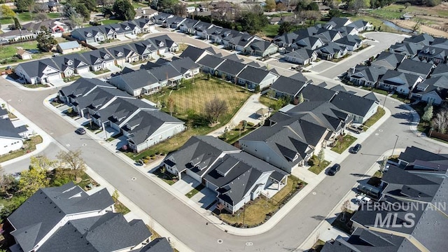 birds eye view of property with a residential view