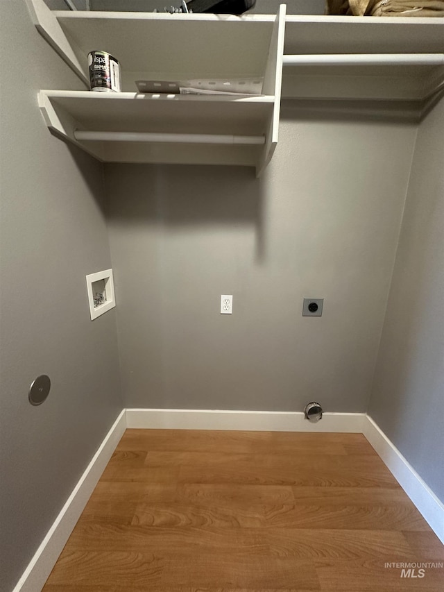 16928 N Chelford Loop, Nampa, ID 83687 - laundry room featuring hookup for a washing machine, hookup for an electric dryer, light wood-style floors, and baseboards