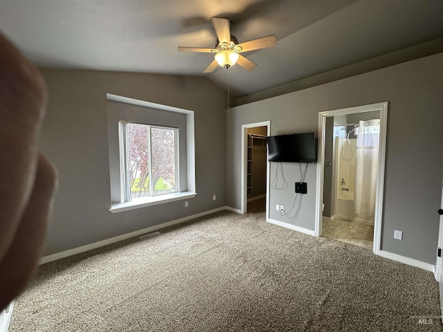 16928 N Chelford Loop, Nampa, ID 83687 - unfurnished bedroom featuring carpet floors, a spacious closet, vaulted ceiling, a closet, and connected bathroom