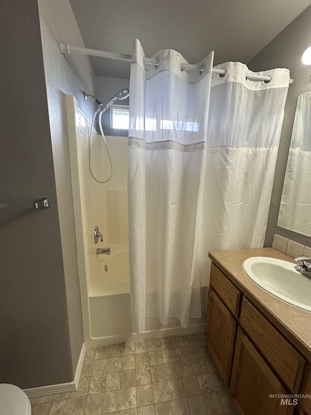 16928 N Chelford Loop, Nampa, ID 83687 - full bathroom featuring shower / tub combo with curtain, vanity, and baseboards