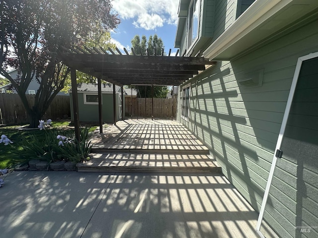 16928 N Chelford Loop, Nampa, ID 83687 - fenced backyard with a pergola and a patio area