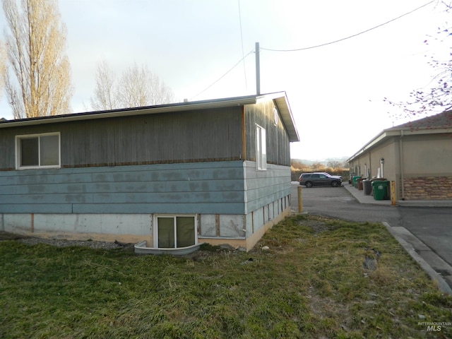 view of home's exterior featuring a yard