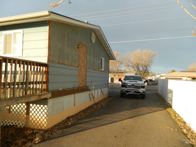 view of home's exterior featuring a deck