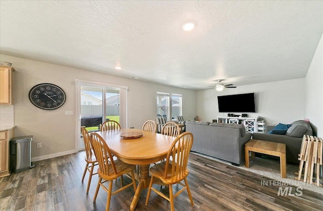 11299 W Taviton St, Nampa, ID 83651 - dining area featuring a ceiling fan, dark wood-style floors, baseboards, and a textured ceiling