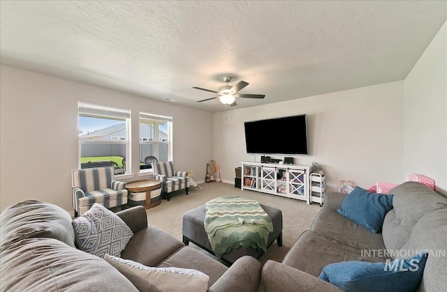 11299 W Taviton St, Nampa, ID 83651 - carpeted living area featuring a ceiling fan, a textured ceiling, and baseboards