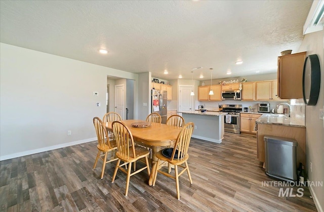 11299 W Taviton St, Nampa, ID 83651 - dining area with dark wood-style floors, recessed lighting, and baseboards