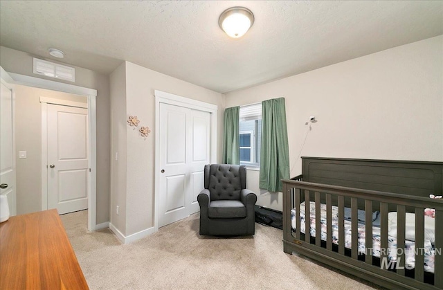 11299 W Taviton St, Nampa, ID 83651 - carpeted bedroom with baseboards, a closet, and a textured ceiling