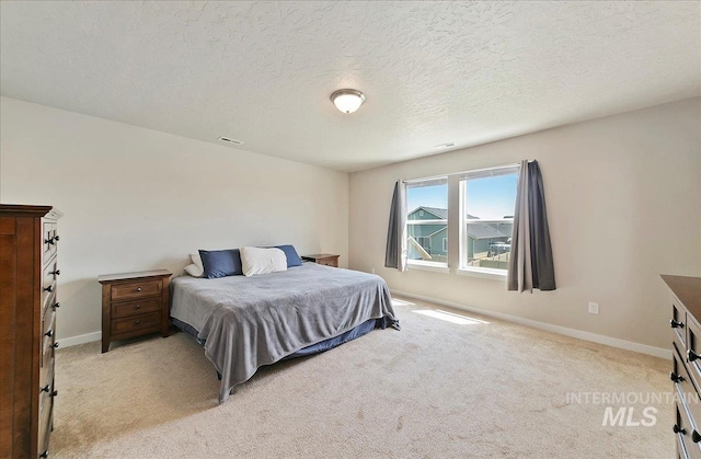 11299 W Taviton St, Nampa, ID 83651 - bedroom with light colored carpet, baseboards, and a textured ceiling