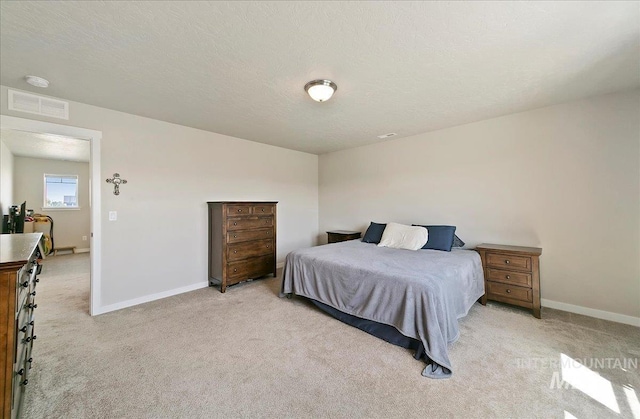 11299 W Taviton St, Nampa, ID 83651 - bedroom with light colored carpet, baseboards, and a textured ceiling