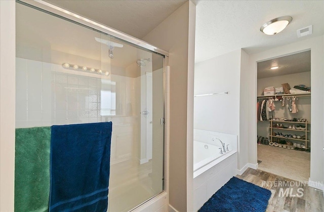11299 W Taviton St, Nampa, ID 83651 - full bath featuring a shower stall, a spacious closet, and a bath