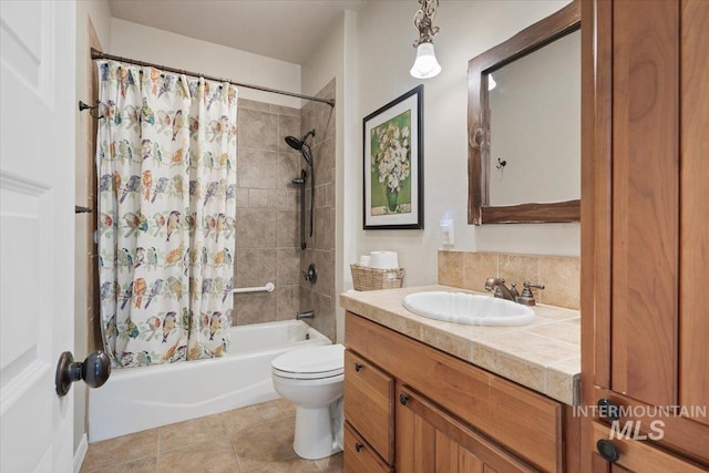 full bathroom with tasteful backsplash, tile patterned floors, vanity, shower / tub combo with curtain, and toilet