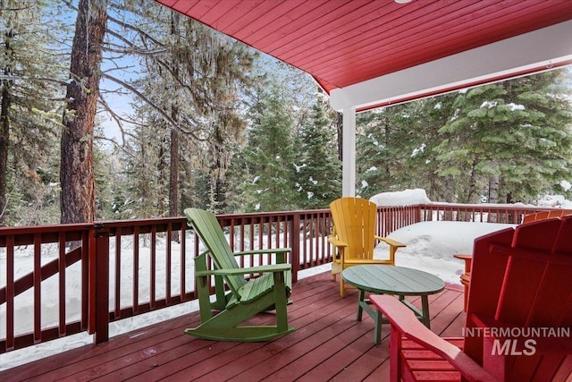 view of snow covered deck