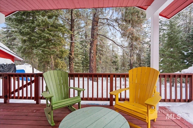 view of snow covered deck