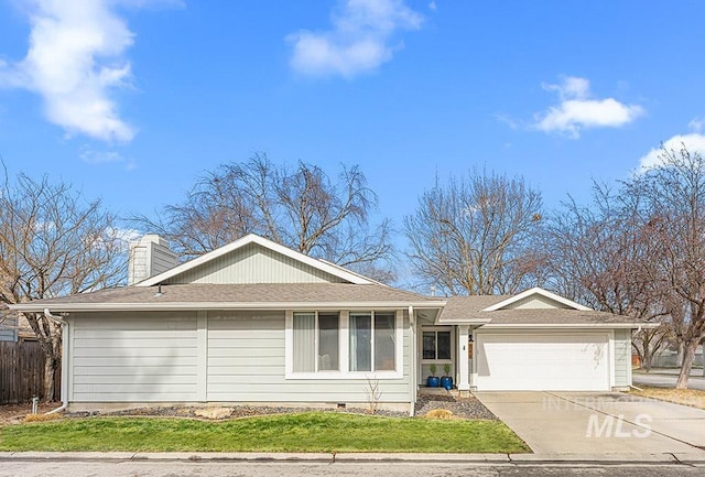 ranch-style home featuring an attached garage, fence, concrete driveway, crawl space, and a chimney