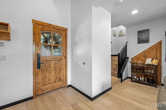 7 Golden Bench Ct, Donnelly, ID 83615 - foyer entrance with light wood finished floors and stairs