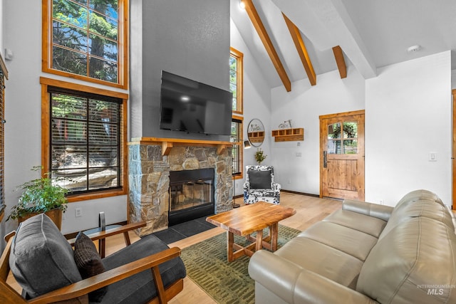7 Golden Bench Ct, Donnelly, ID 83615 - living area featuring high vaulted ceiling, beam ceiling, a fireplace, and wood finished floors