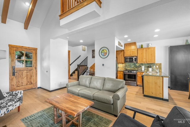 7 Golden Bench Ct, Donnelly, ID 83615 - living room with stairway, light wood-style flooring, a high ceiling, and recessed lighting