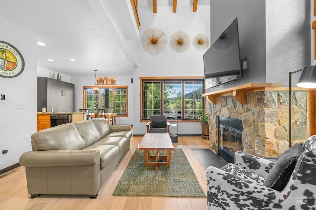 7 Golden Bench Ct, Donnelly, ID 83615 - living area with wood finished floors, a stone fireplace, and recessed lighting