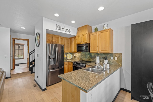 7 Golden Bench Ct, Donnelly, ID 83615 - kitchen with stainless steel fridge with ice dispenser, electric stove, decorative backsplash, light wood-style flooring, and recessed lighting