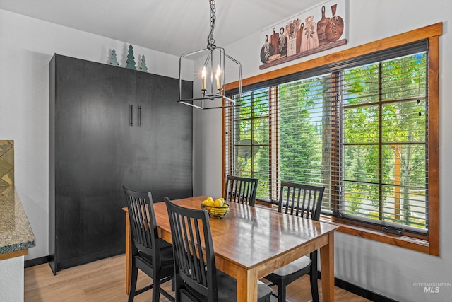 7 Golden Bench Ct, Donnelly, ID 83615 - dining room with a chandelier and light wood-type flooring