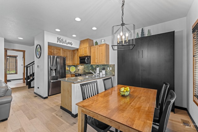 7 Golden Bench Ct, Donnelly, ID 83615 - dining space featuring light wood-style flooring, a chandelier, recessed lighting, and stairs