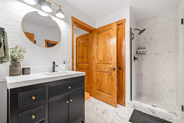 7 Golden Bench Ct, Donnelly, ID 83615 - bathroom featuring tiled shower, vanity, and marble look tiles