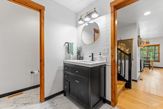 7 Golden Bench Ct, Donnelly, ID 83615 - bathroom featuring vanity and marble look tiles