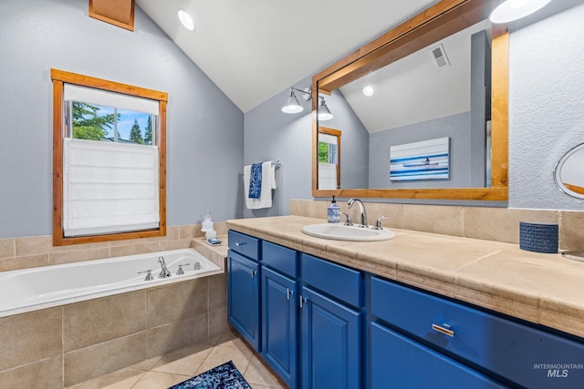 7 Golden Bench Ct, Donnelly, ID 83615 - full bathroom with vaulted ceiling, tile patterned flooring, vanity, plenty of natural light, and a bath
