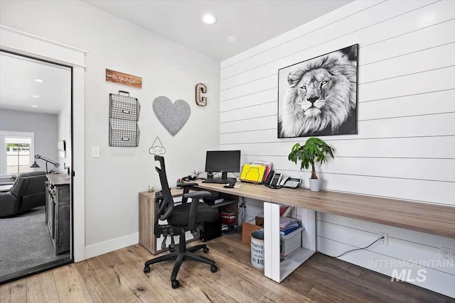 home office featuring hardwood / wood-style flooring