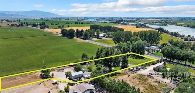 drone / aerial view featuring a rural view and a mountain view