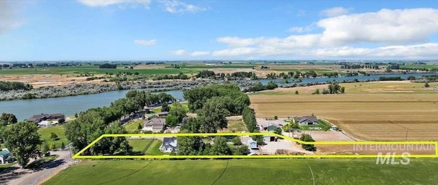 birds eye view of property featuring a water view and a rural view