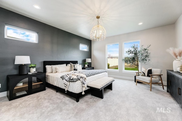 bedroom with baseboards, a notable chandelier, recessed lighting, and light colored carpet