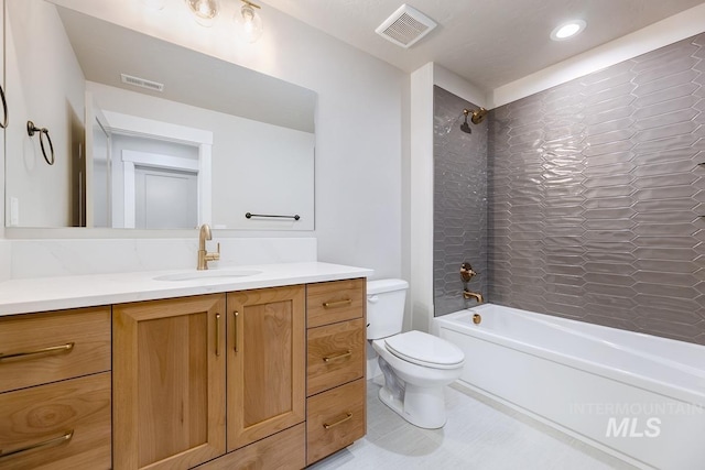 full bathroom featuring visible vents, shower / tub combination, toilet, and vanity