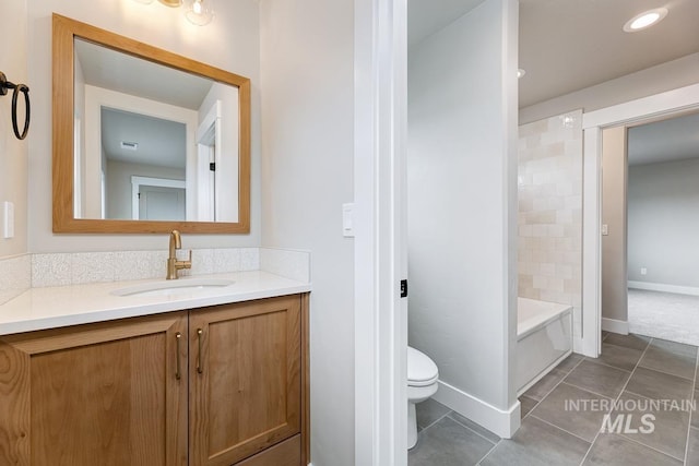 full bathroom featuring bathtub / shower combination, vanity, toilet, tile patterned floors, and baseboards